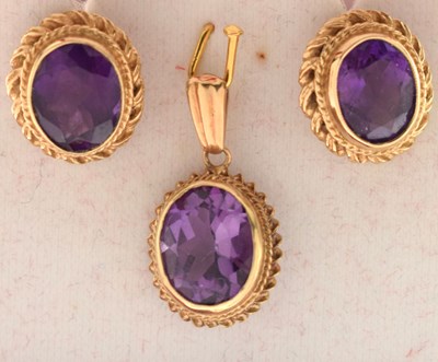 Lot 91 - Pair of 9ct gold ear studs set amethyst-coloured oval faceted stones