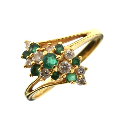Lot 45 - Emerald and diamond 18ct gold cluster ring