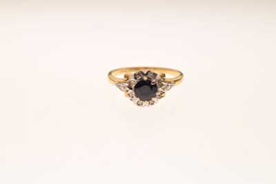 Lot 44 - Sapphire and diamond illusion set cluster ring