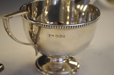 Lot 190 - George VI silver milk jug, together with a George V silver trophy vase