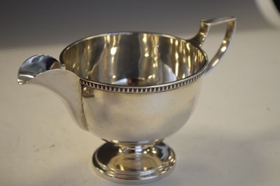 Lot 190 - George VI silver milk jug, together with a George V silver trophy vase