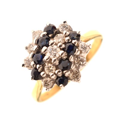 Lot 42 - Sapphire and diamond three-tier flower head cluster 18ct gold ring