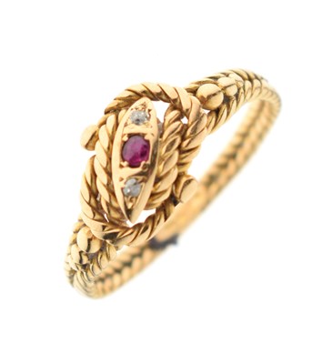 Lot 29 - Ruby and diamond 18ct gold rope twist ring