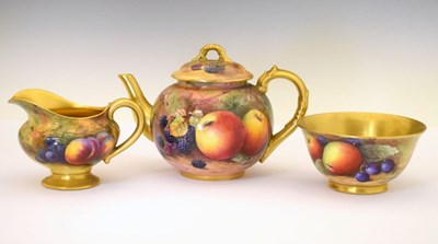 Lot 340 - George V Royal Worcester porcelain fruit-painted teapot, milk jug and sugar basin