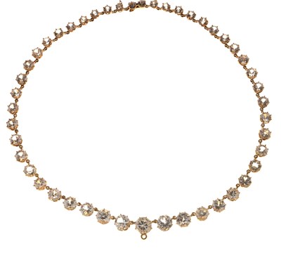 Lot 55 - Yellow metal and white paste rivière necklace