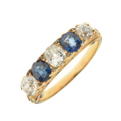 Lot 38 - Five-stone diamond and sapphire ring