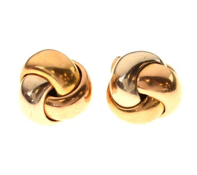 Lot 63 - Pair of three-colour 18ct gold knot earrings, in the style of Cartier