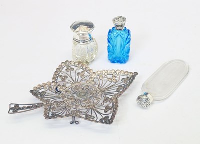 Lot 277 - Three silver-topped perfume/scent bottles and a white-metal pierced leaf coin dish