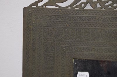 Lot 376 - Unusual antique brass Islamic script wall mirror