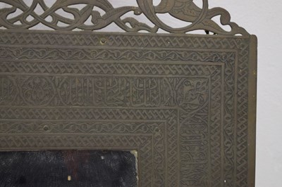 Lot 376 - Unusual antique brass Islamic script wall mirror