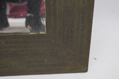 Lot 376 - Unusual antique brass Islamic script wall mirror