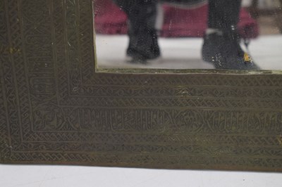 Lot 376 - Unusual antique brass Islamic script wall mirror
