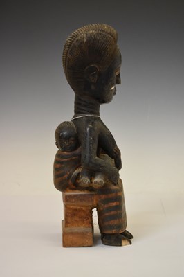 Lot Ethnographica - African carved wooden fertility figure, mother and two children