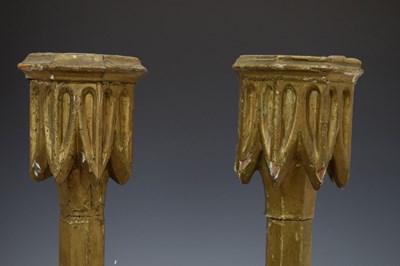 Lot Near pair of 18th century giltwood candlesticks, octagonal bases