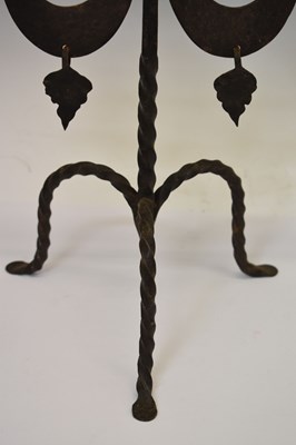 Lot Pair of wrought iron two-branch (three sconce) candlesticks
