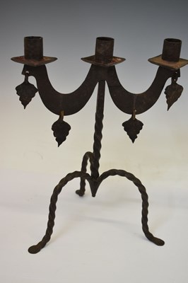 Lot Pair of wrought iron two-branch (three sconce) candlesticks