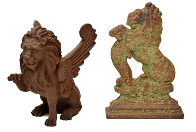 Lot 232 - Victorian cast iron door stop modelled as a lion  and a cast iron model of a classical winged lion