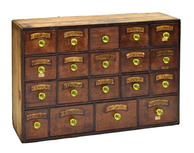 Lot 19th century bank of nineteen apothecary or Chemist's drawers