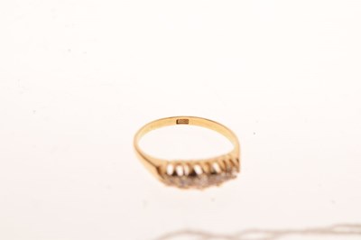 Lot 26 - Yellow metal '15ct' five-stone diamond ring