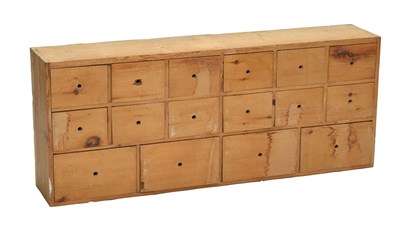 Lot 764 - Bank of sixteen pine drawers