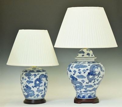 Lot 425 - Two blue and white porcelain table lamps