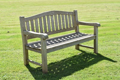 Lot 787 - Two person teak garden bench with arched back