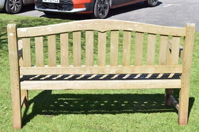 Lot 787 - Two person teak garden bench with arched back