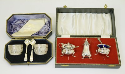 Lot 293 - Cased pair of Victorian silver salts, and a cased Elizabeth II silver three-piece condiment set