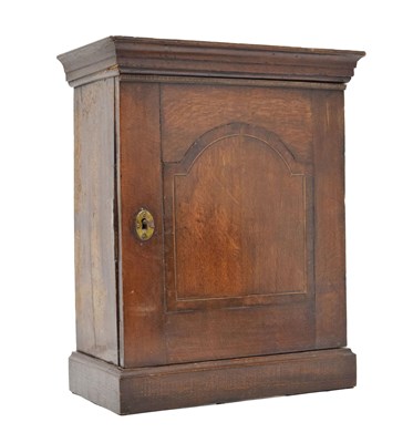 Lot 707 - 18th century oak and inlaid spice cupboard