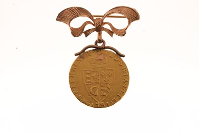Lot 130 - George III gold guinea, 1791, with a later 9ct brooch mount
