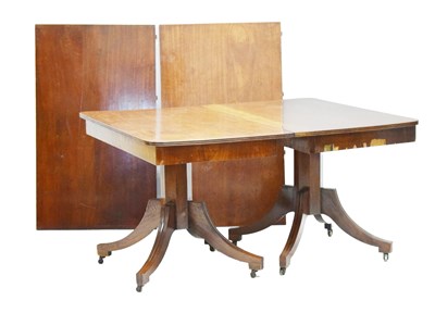 Lot 723 - Late Georgian mahogany twin pillar extending dining table