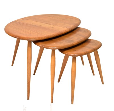 Lot 518 - Set of three Ercol 'pebble' tables