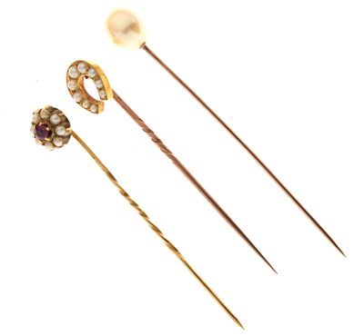 Lot 121 - Three pearl set stickpins