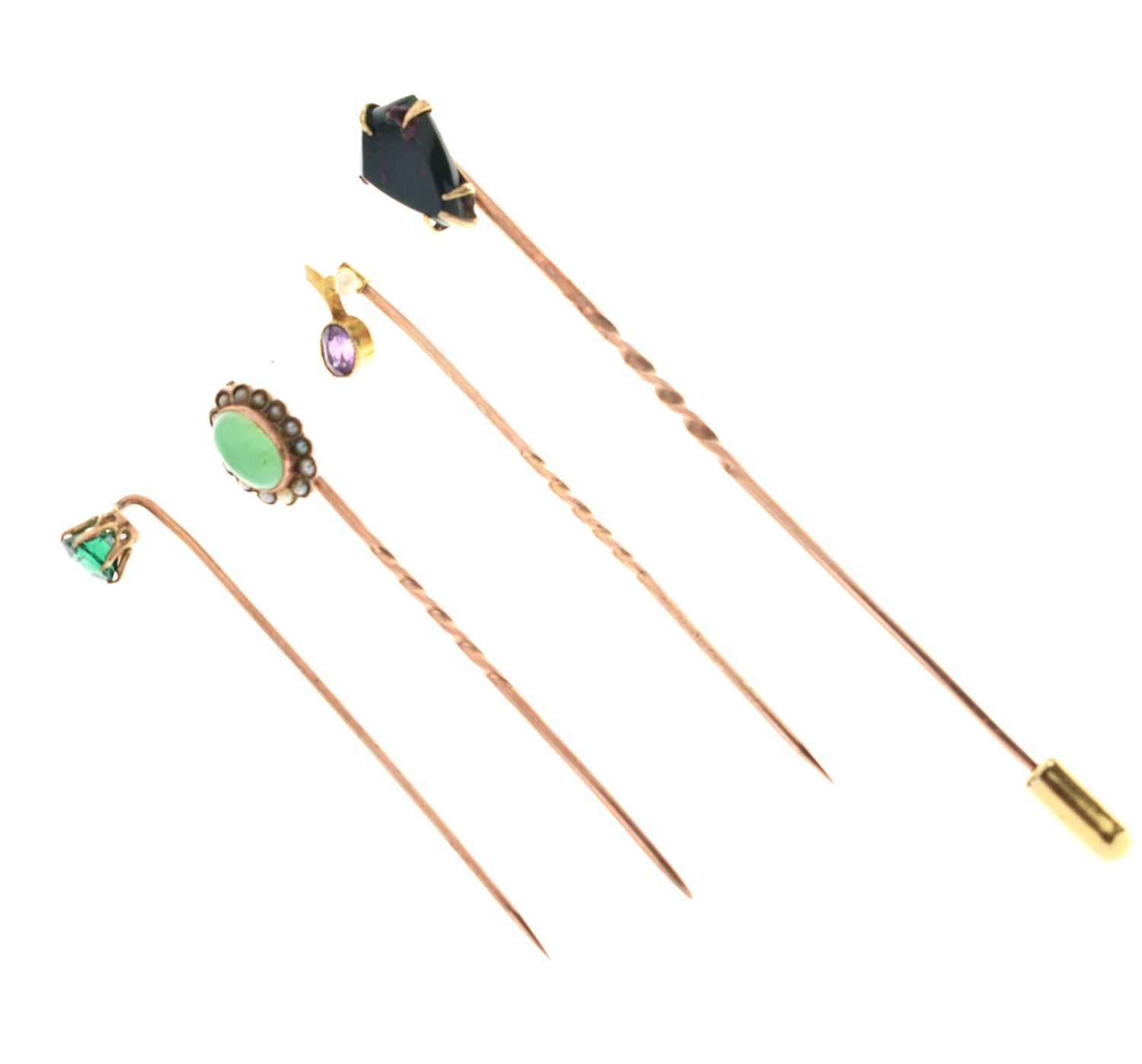 Lot 123 - Four gem-set stick pins