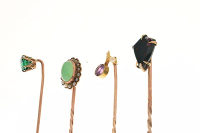 Lot 123 - Four gem-set stick pins