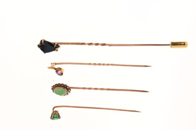 Lot 123 - Four gem-set stick pins