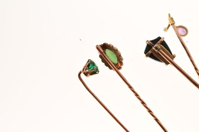 Lot 123 - Four gem-set stick pins