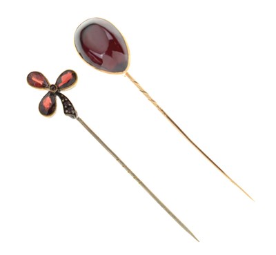 Lot 124 - Two red stone set stick pins