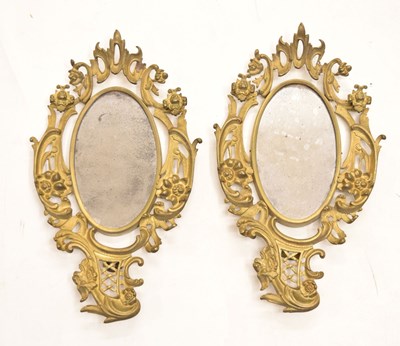 Lot 694 - Pair of gilt metal wall mirrors