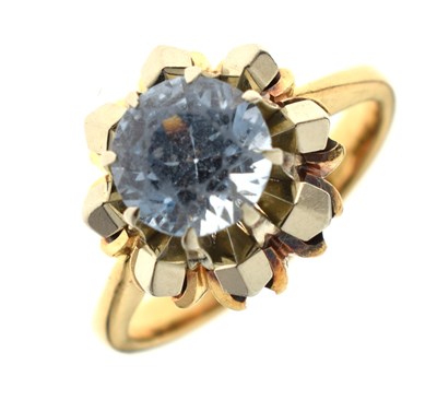 Lot 54 - Single stone ring, claw set a faceted round pale blue stone