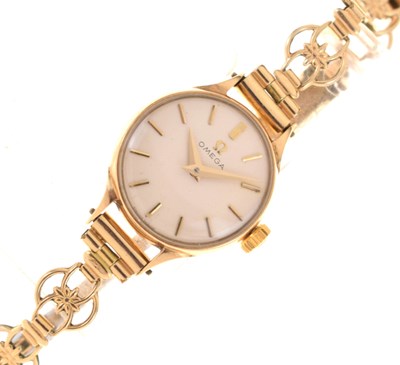 Lot 244 - Omega - Lady's 9ct gold cased bracelet watch