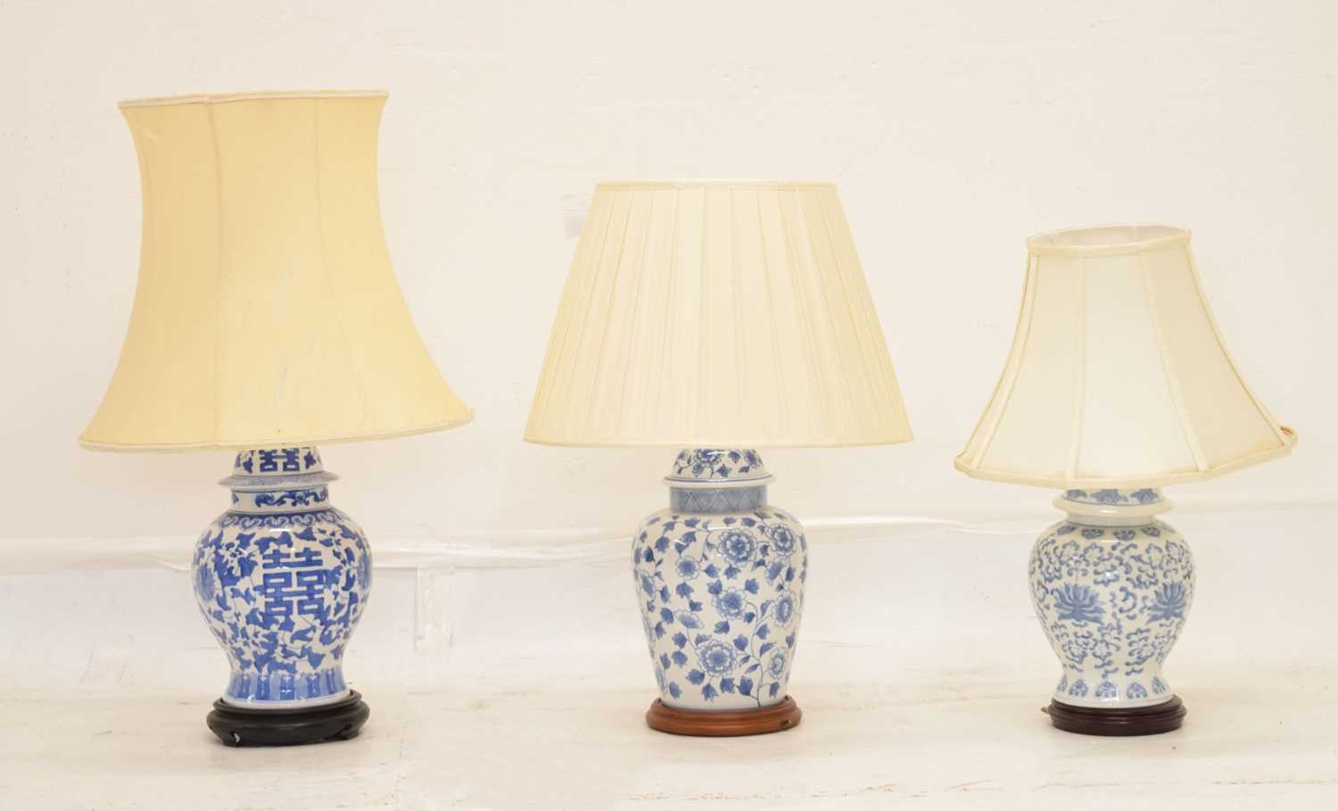 Lot 426 - Three modern Chinese blue and white table lamps