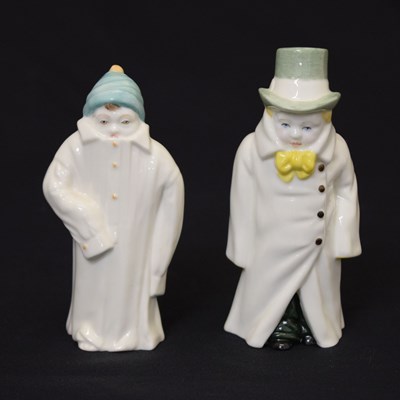 Lot 542 - Royal Worcester - Two porcelain candle snuffers