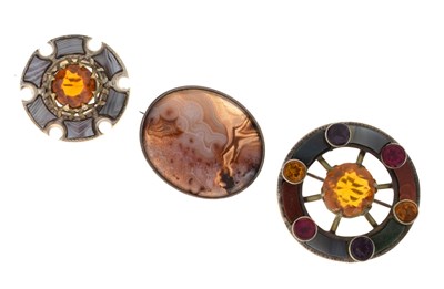 Lot 131 - Two Scottish-style agate and gem-set silver brooches