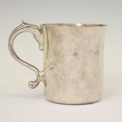 Lot 258 - George V silver mug with leaf-capped scroll handle