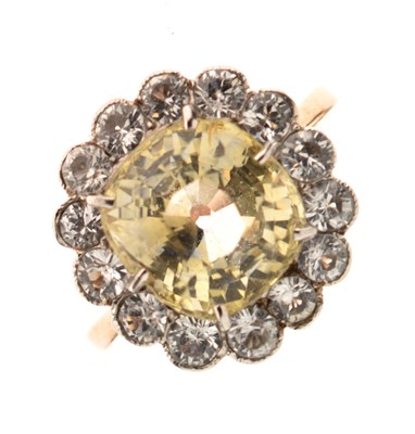 Lot 6 - Yellow sapphire and white sapphire cluster ring