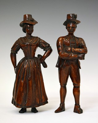 Lot 203 - Pair of early 19th century Black Forest type carved fruitwood figures