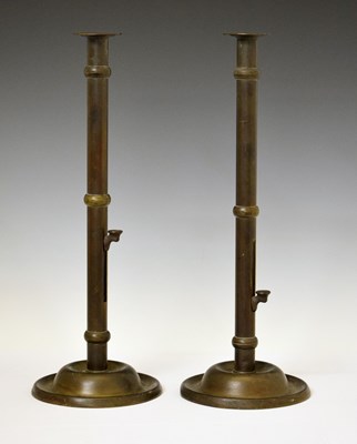 Lot 169 - Large pair of George III-style brass 'Hogscraper' type ejector candlesticks