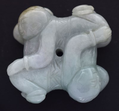 Lot 588 - 20th century carved pale jade group of two reclining boys