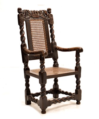 Lot 557 - Charles II child's carved walnut cane-seated elbow chair